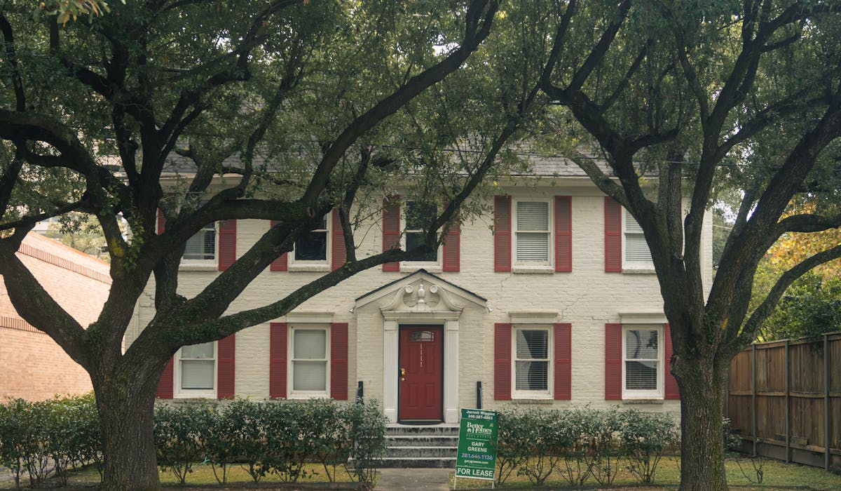 Historic colonial home in Lexington Massachusetts surrounded by protected mature trees